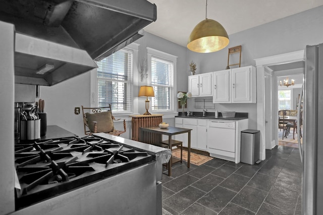 kitchen featuring stainless steel appliances, white cabinetry, a wealth of natural light, range hood, and dark countertops