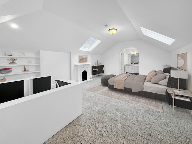 carpeted bedroom with vaulted ceiling