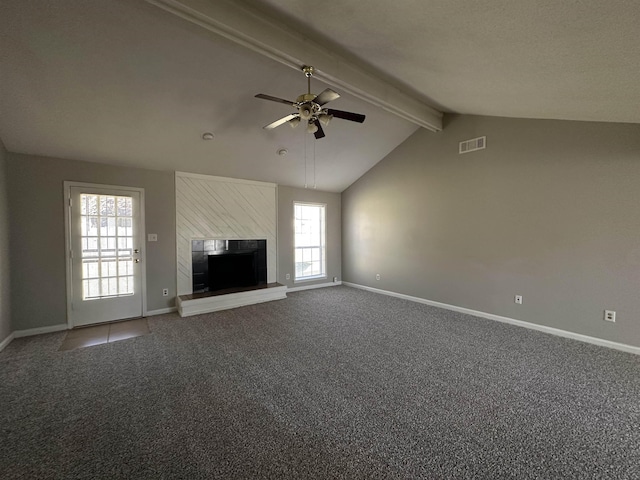 unfurnished living room with vaulted ceiling with beams, carpet, visible vents, and baseboards