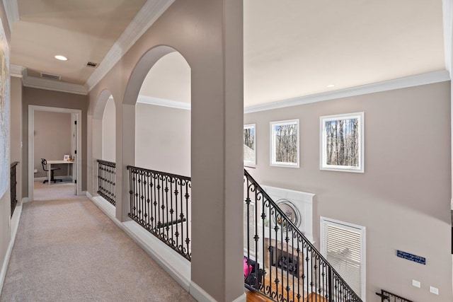 hall featuring carpet floors, recessed lighting, visible vents, ornamental molding, and baseboards