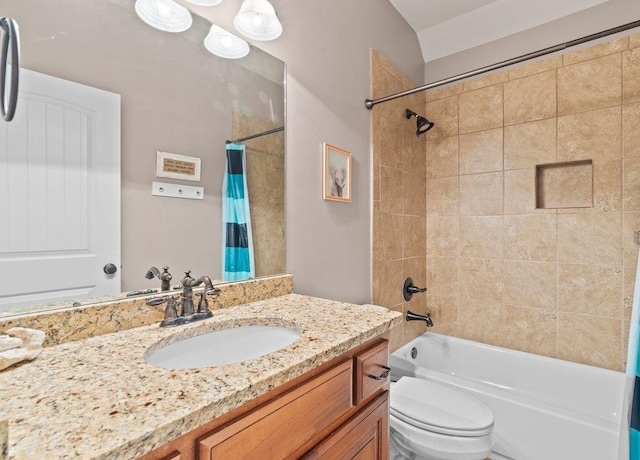 full bathroom with vanity, toilet, and shower / tub combo with curtain