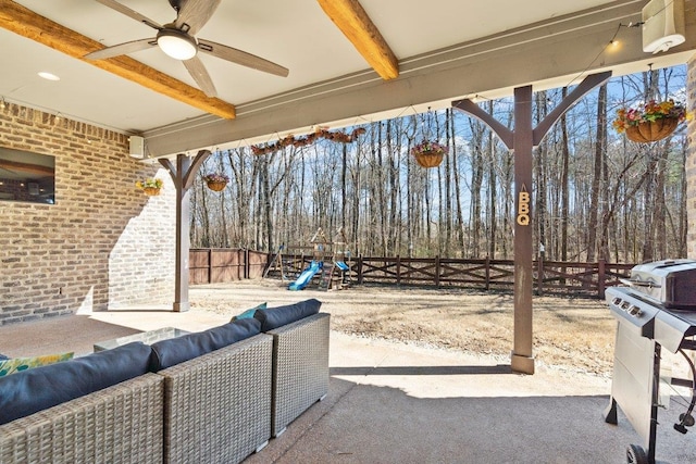 view of patio / terrace featuring a playground, fence, an outdoor living space, and ceiling fan