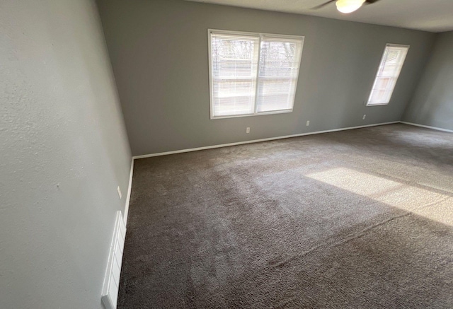 spare room with carpet flooring and baseboards