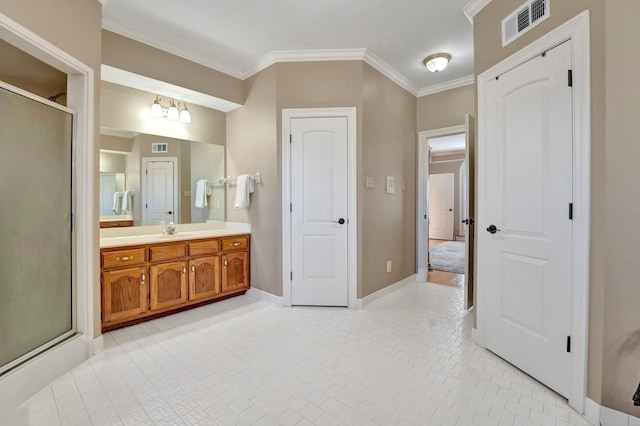 full bathroom with crown molding, visible vents, a shower stall, vanity, and baseboards