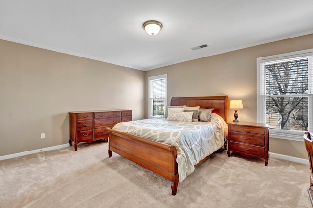 bedroom featuring light colored carpet, visible vents, and baseboards