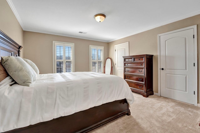 bedroom with visible vents, ornamental molding, and light colored carpet