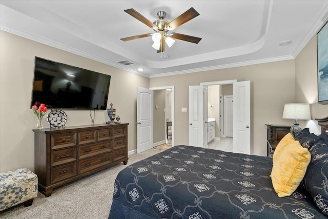 bedroom featuring connected bathroom, light colored carpet, a ceiling fan, visible vents, and a raised ceiling