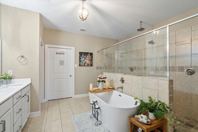 bathroom featuring visible vents, a freestanding bath, vanity, tiled shower, and tile patterned floors