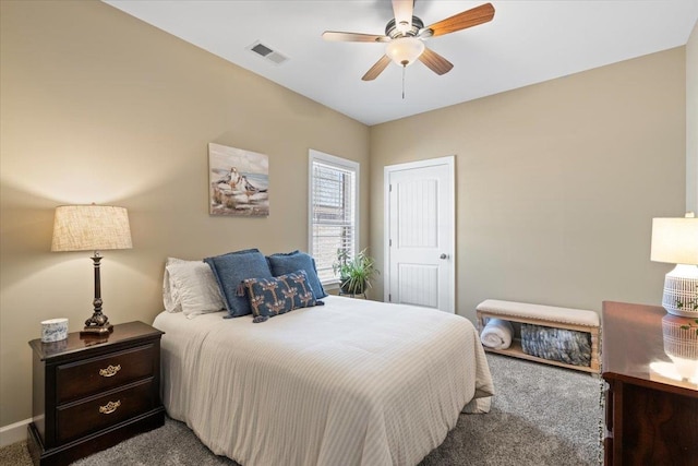 bedroom with carpet, visible vents, and ceiling fan