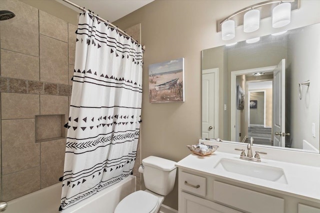 full bath with vanity, shower / bath combo with shower curtain, and toilet