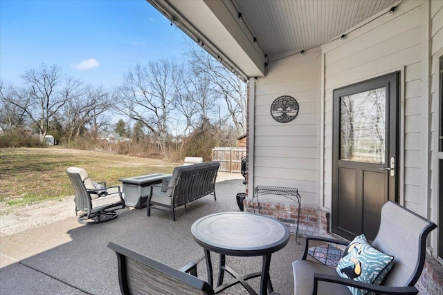 view of patio / terrace with outdoor dining area and fence