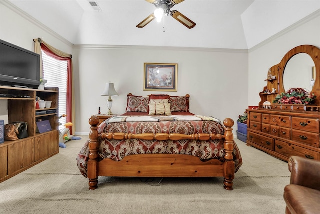 carpeted bedroom featuring lofted ceiling, crown molding, visible vents, and a ceiling fan