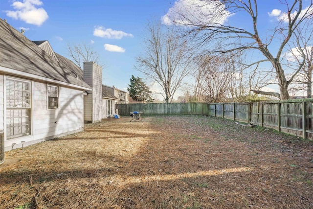 view of yard featuring a fenced backyard