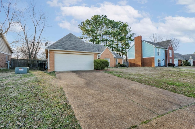 view of front of home with a garage, brick siding, a shingled roof, fence, and a front lawn