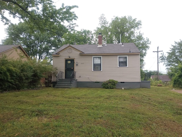 view of front of home featuring crawl space, a chimney, and a front yard