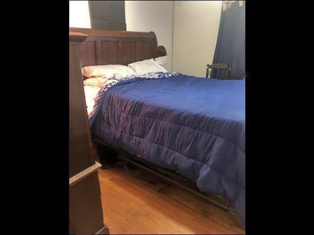 bedroom with wood finished floors