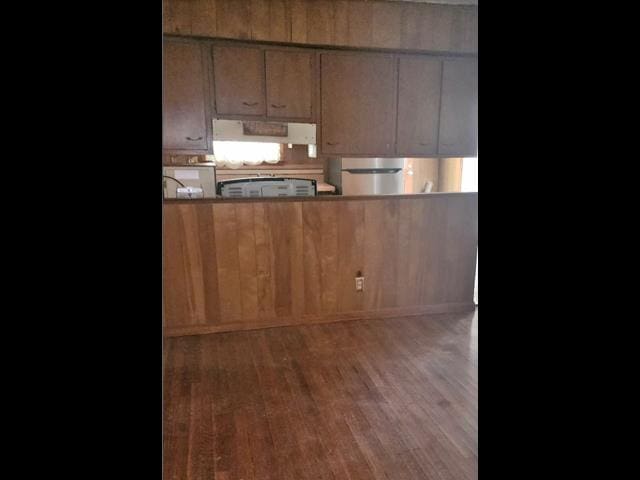 kitchen featuring extractor fan and wood finished floors