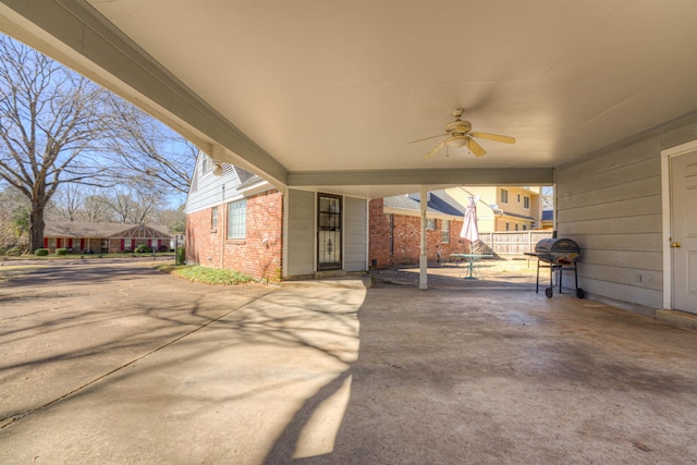 view of patio / terrace featuring ceiling fan and fence