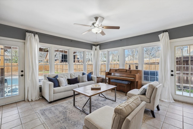 sunroom featuring ceiling fan