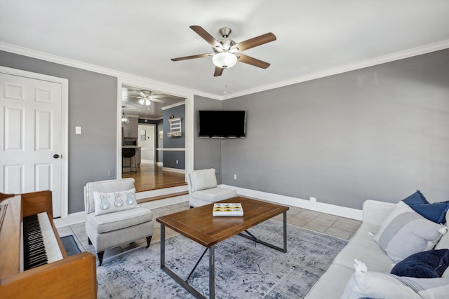 living room with ceiling fan, baseboards, crown molding, and tile patterned floors