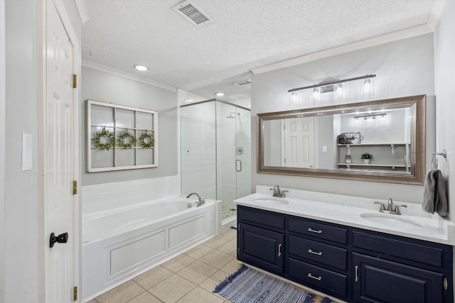 bathroom featuring a bath, ornamental molding, a sink, and visible vents