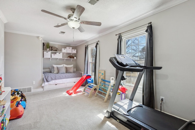 interior space with ornamental molding, visible vents, and carpet floors