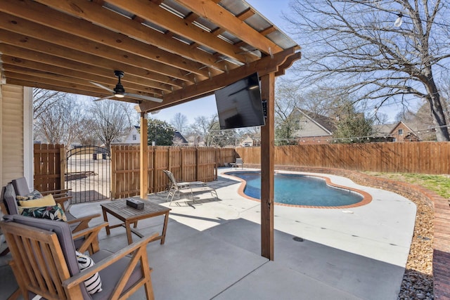 view of patio / terrace featuring a fenced backyard, a fenced in pool, and a ceiling fan