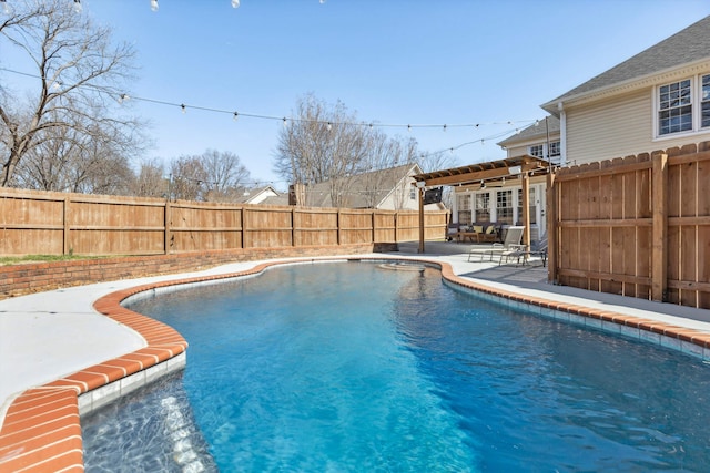 view of swimming pool featuring a fenced in pool, a fenced backyard, and a patio