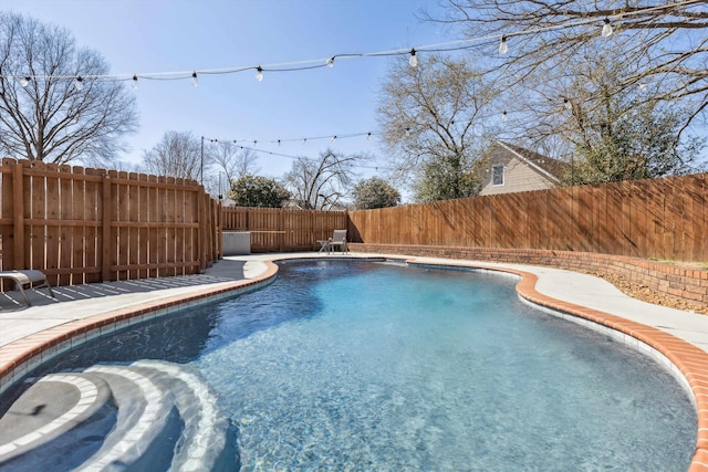 view of pool with a fenced backyard and a fenced in pool