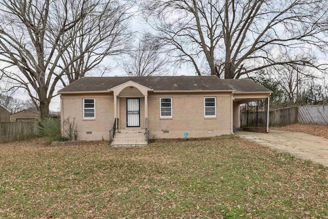 view of front of house featuring crawl space, fence, concrete driveway, and brick siding