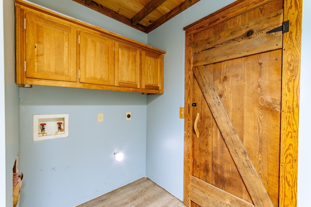 laundry room with cabinet space, wooden ceiling, light wood-style flooring, hookup for an electric dryer, and washer hookup