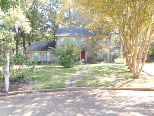 colonial house with a front lawn