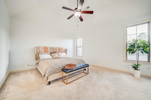 carpeted bedroom featuring a ceiling fan, vaulted ceiling, and baseboards