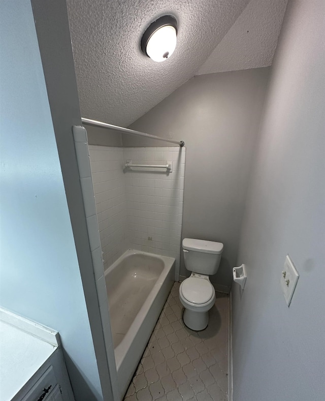 bathroom with shower / washtub combination, a textured ceiling, toilet, and vanity