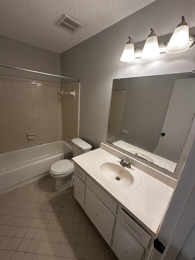 bathroom with a textured ceiling, toilet, shower / bath combination, vanity, and visible vents