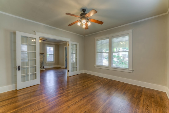 unfurnished room featuring ornamental molding, french doors, and dark wood finished floors