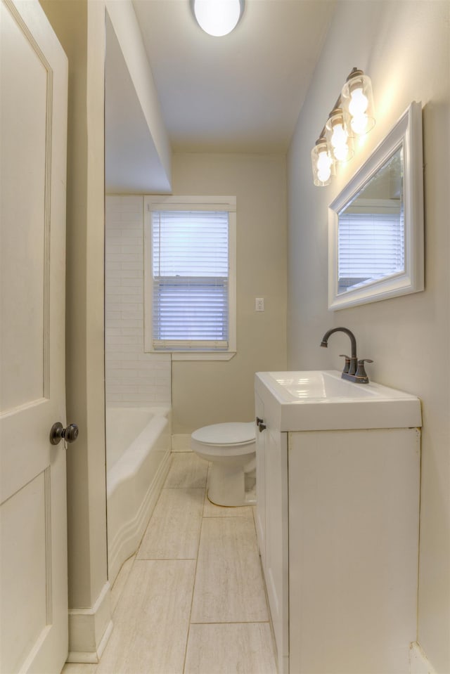 bathroom with a tub, a shower, vanity, and toilet