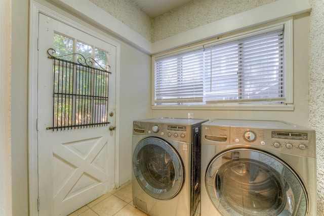 washroom with laundry area, independent washer and dryer, and light tile patterned floors