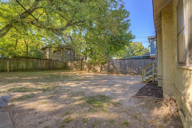 view of yard with a fenced backyard