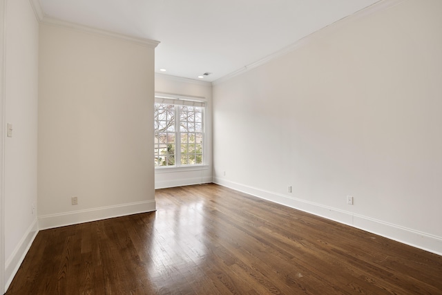 empty room with recessed lighting, wood finished floors, visible vents, baseboards, and crown molding