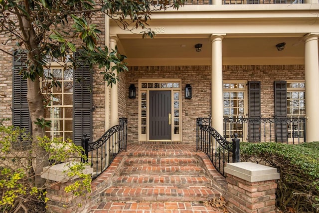 property entrance with brick siding