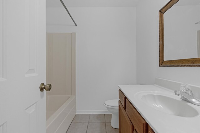 full bath with baseboards, vanity, toilet, and tile patterned floors