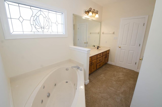 full bathroom with a tub with jets and vanity