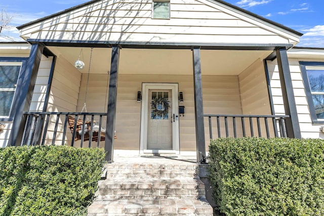 entrance to property with covered porch