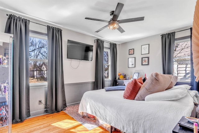 bedroom featuring wood finished floors and a ceiling fan