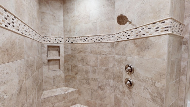 details featuring tiled shower