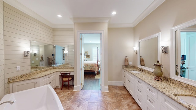 bathroom with double vanity, recessed lighting, a freestanding bath, a sink, and a tile shower