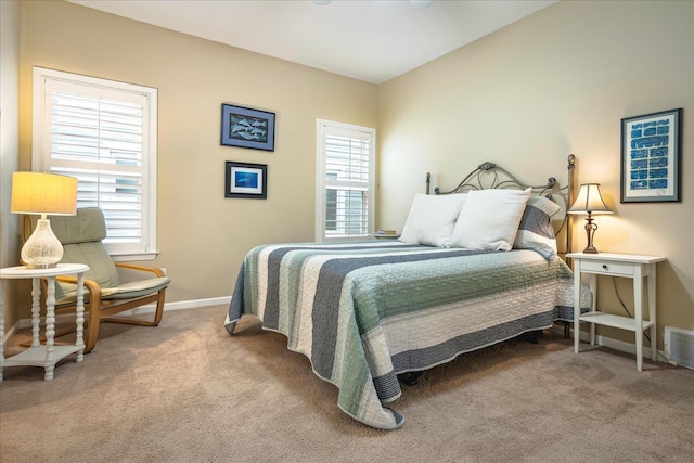 bedroom featuring carpet floors and baseboards