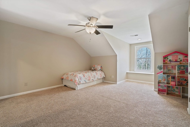 unfurnished bedroom featuring lofted ceiling, visible vents, carpet flooring, ceiling fan, and baseboards