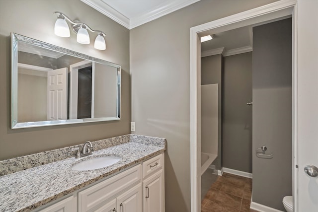 bathroom with toilet, a washtub, crown molding, and vanity